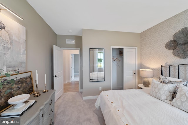 carpeted bedroom with a closet