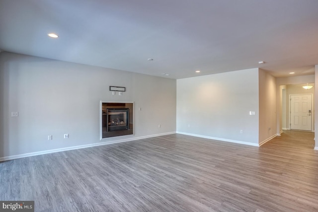 unfurnished living room featuring light wood-type flooring