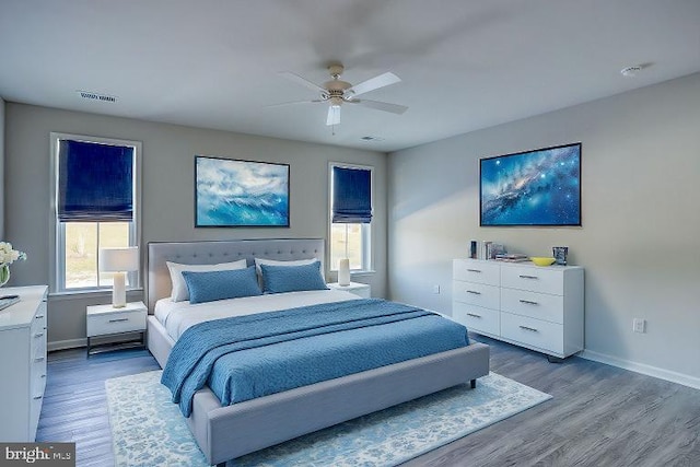 bedroom with ceiling fan and wood-type flooring