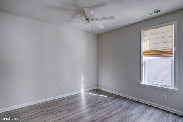 spare room with ceiling fan and hardwood / wood-style floors