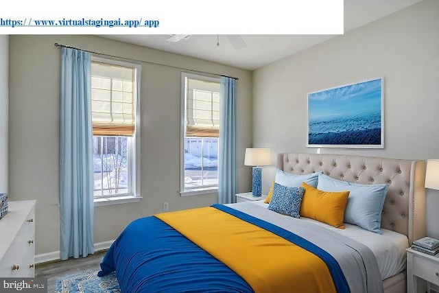 bedroom featuring ceiling fan, multiple windows, and light hardwood / wood-style flooring