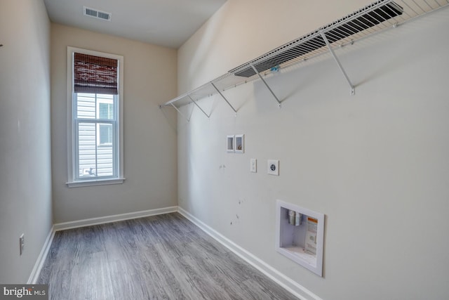 laundry area featuring washer hookup, hookup for an electric dryer, and hardwood / wood-style flooring