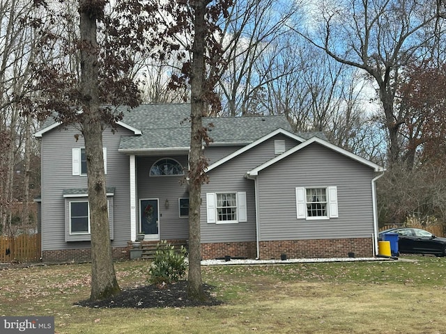 front facade featuring a front yard