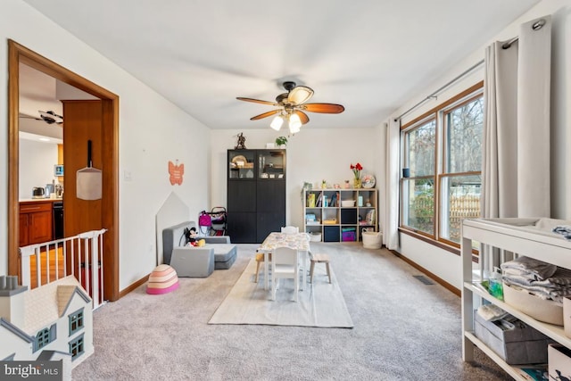 game room featuring ceiling fan and carpet