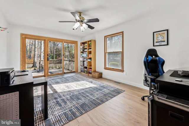 office area featuring ceiling fan and light hardwood / wood-style floors