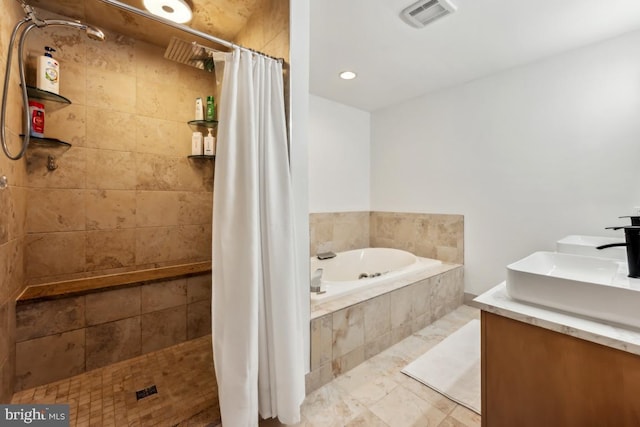 bathroom featuring plus walk in shower and vanity