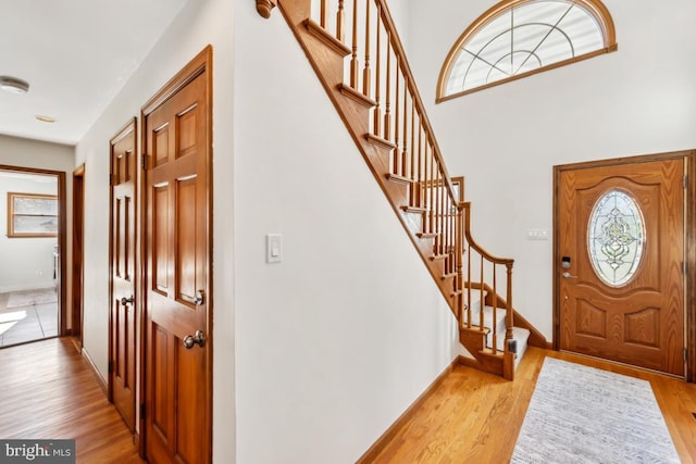 foyer entrance with light hardwood / wood-style floors