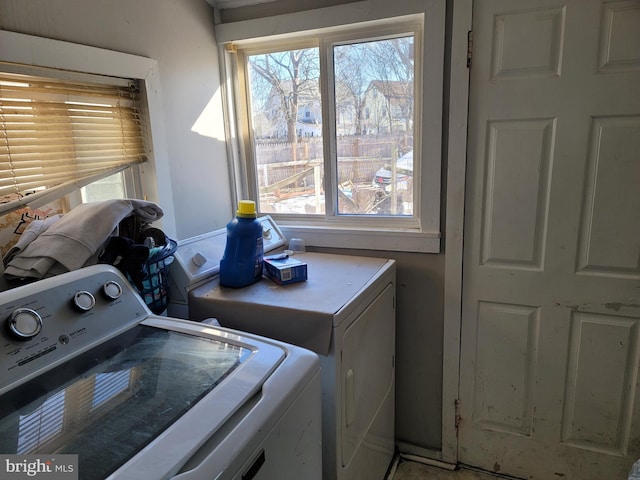 washroom featuring washing machine and dryer