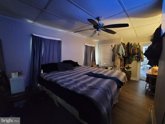 bedroom with ceiling fan and wood-type flooring