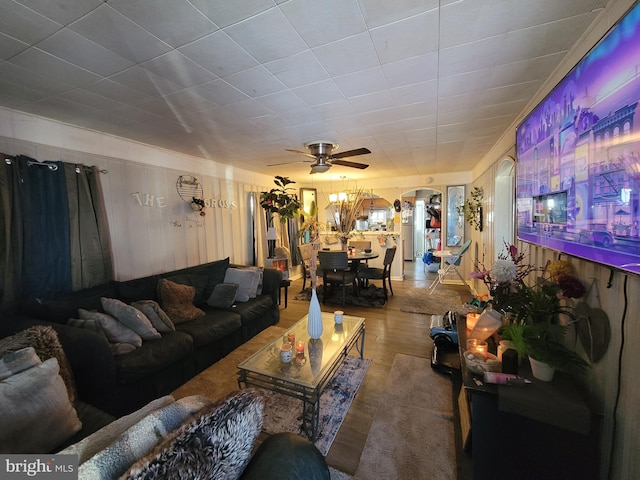 living room with ceiling fan and hardwood / wood-style floors