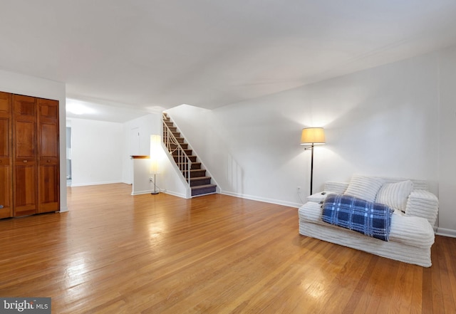 living area with hardwood / wood-style floors