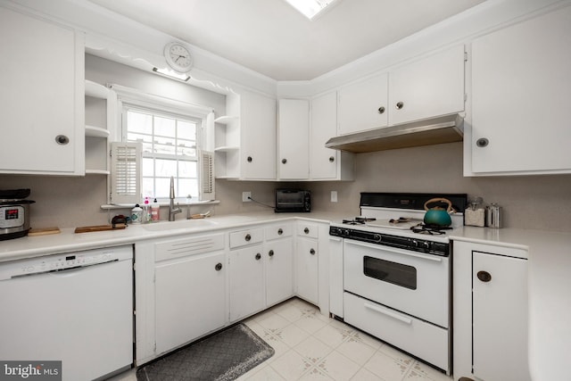 kitchen featuring white appliances, sink, and white cabinetry