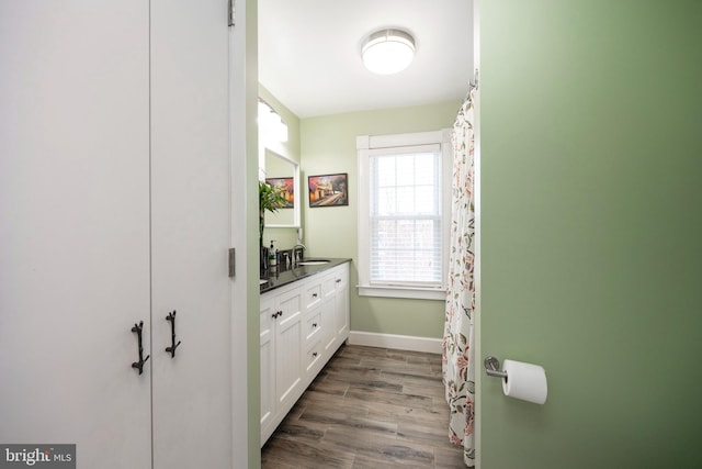 bathroom featuring wood-type flooring and vanity