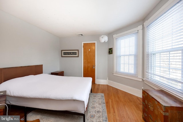 bedroom with light wood-type flooring