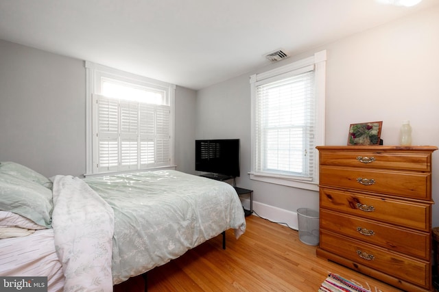 bedroom with light hardwood / wood-style flooring