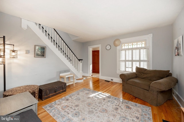 living room with light hardwood / wood-style floors