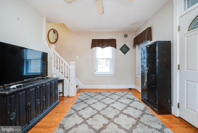 entryway featuring wood-type flooring and ceiling fan