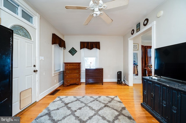 entrance foyer featuring ceiling fan and light wood-type flooring