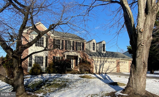 colonial-style house featuring a garage