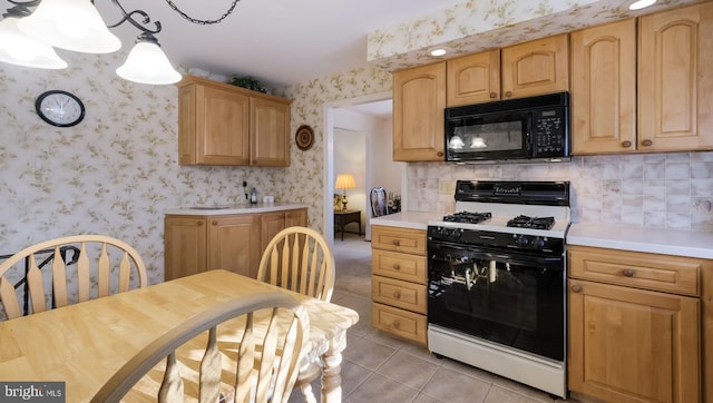 kitchen with pendant lighting, range with gas cooktop, backsplash, and light tile patterned flooring