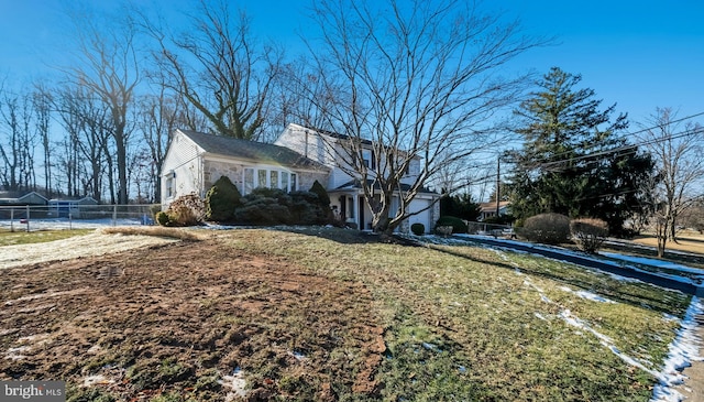 view of side of home featuring a lawn