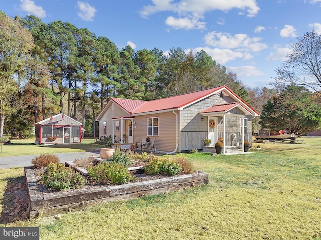 view of front of house with a front lawn and a patio