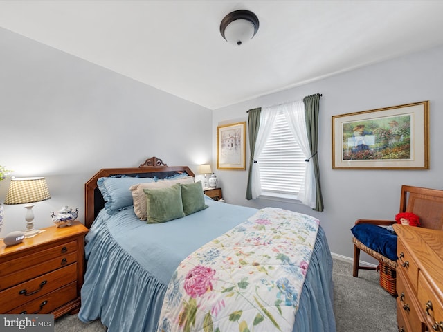 bedroom with light colored carpet