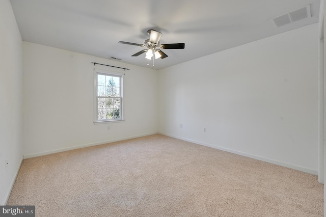 empty room with light carpet and ceiling fan