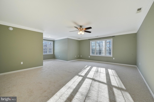 carpeted empty room with ornamental molding and ceiling fan