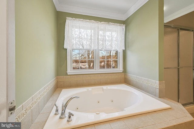 bathroom featuring tiled tub and crown molding