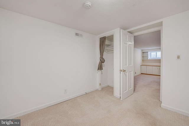 interior space with a textured ceiling