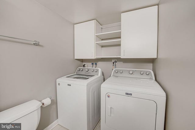 clothes washing area with separate washer and dryer