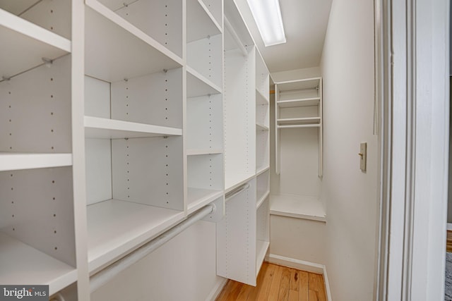 walk in closet featuring hardwood / wood-style floors