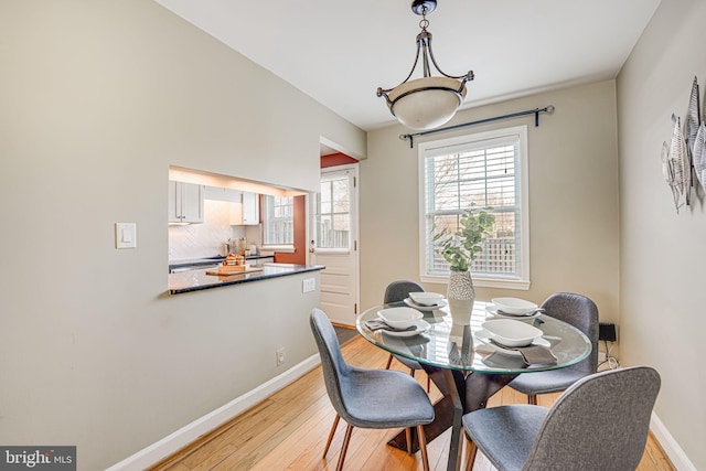 dining area featuring light wood-type flooring