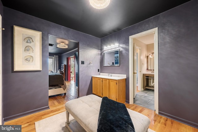 bathroom with vanity and hardwood / wood-style floors