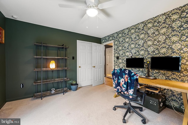 home office featuring ceiling fan and carpet