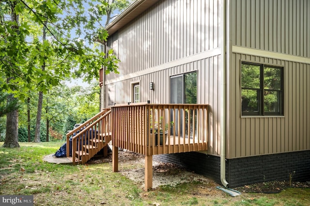 view of side of property with a deck