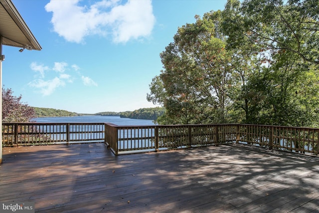 wooden deck with a water view