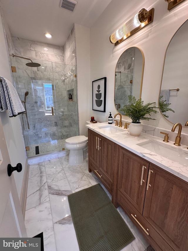 bathroom with vanity, toilet, and walk in shower