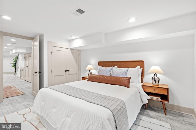 bedroom with a closet and light wood-type flooring