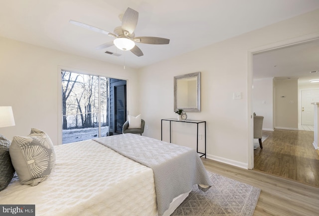 bedroom featuring access to outside, ceiling fan, and light hardwood / wood-style floors