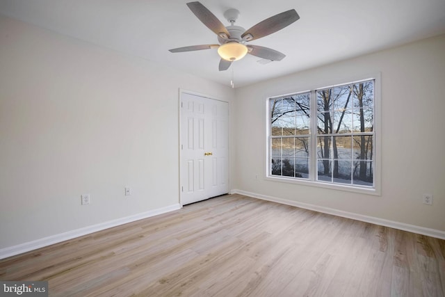 unfurnished room with ceiling fan and light hardwood / wood-style floors