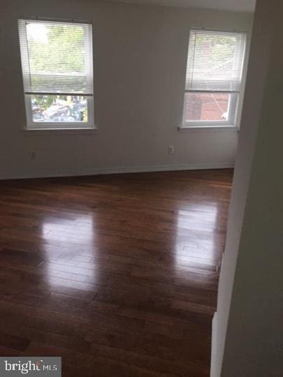 empty room featuring dark hardwood / wood-style floors