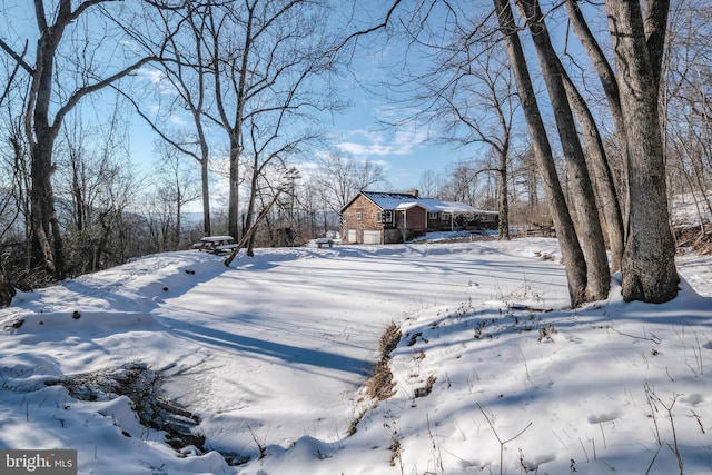 view of yard covered in snow