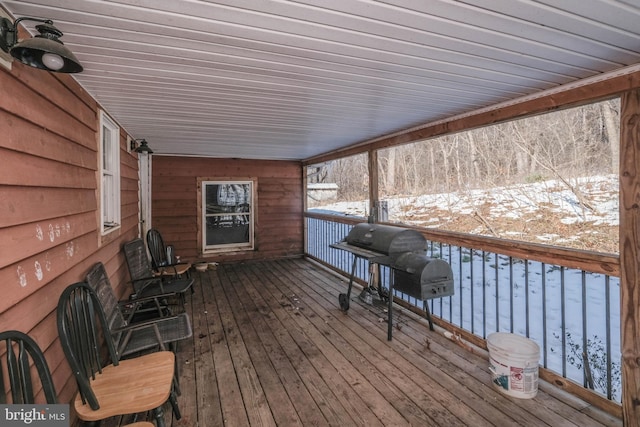 snow covered deck featuring grilling area