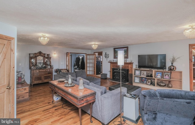 living room with hardwood / wood-style flooring and a textured ceiling