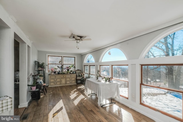 sunroom / solarium featuring ceiling fan