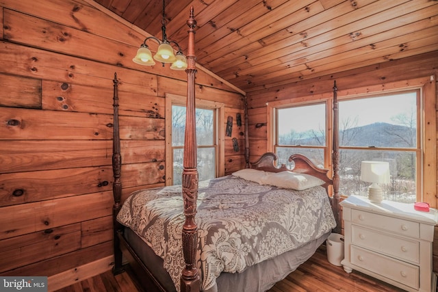 bedroom featuring a mountain view, wooden ceiling, hardwood / wood-style floors, and lofted ceiling