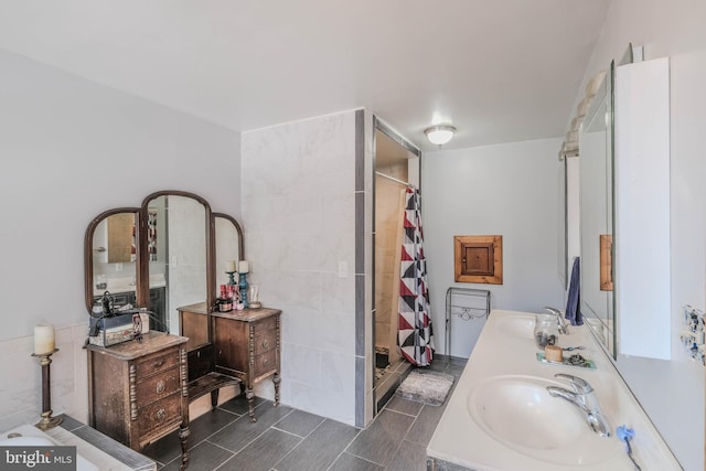 bathroom with vanity and a shower with shower curtain