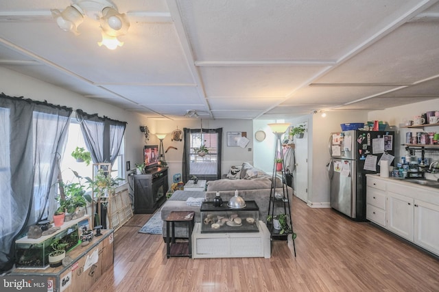 dining room with hardwood / wood-style flooring and sink